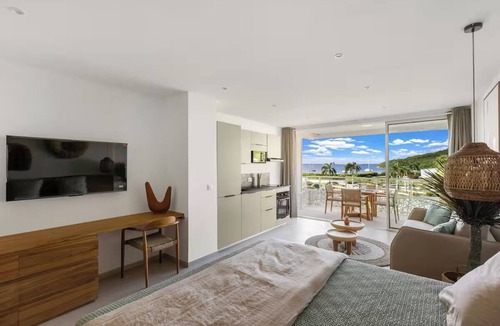 Anse Marcel Hotel | Oceanfront Comfort: Relax in a Roomy Suite with Kitchen Overlooking Anse Marcel