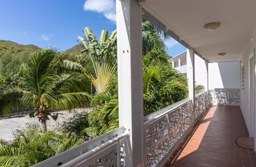 Anse Marcel Hotel | Oceanfront Comfort: Relax in a Roomy Suite with Kitchen Overlooking Anse Marcel