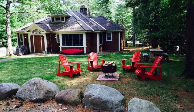 Short walk to village.with private wooded setting. EV Charger in parking area. in Lake Placid